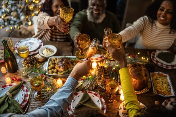 Family toasting on Christmas dinner at home